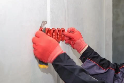 A set of plastic inserts for red and blue sockets. Construction vacuum cleaner Stock Photos