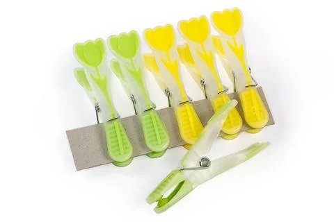 Set of plastic spring-type clothespins on a white background Stock Photos