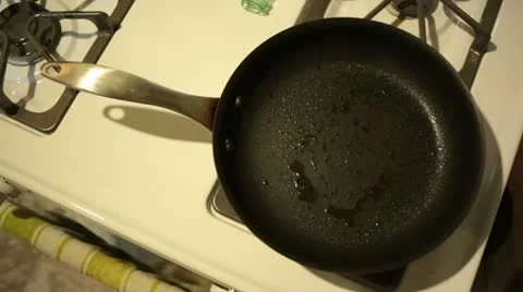 Set Porkchops onto Frying Pan Stock Footage 11857475