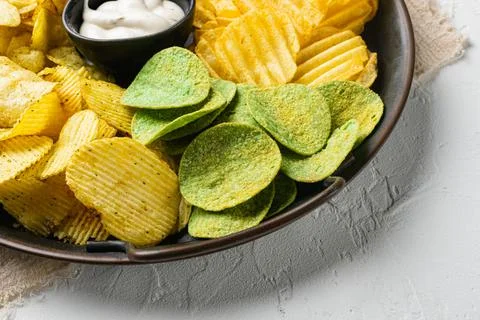 Set potato chips on white stone table background Stock Photos