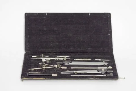 Set of precision technical drawing instruments in black case. Open Stock Photos