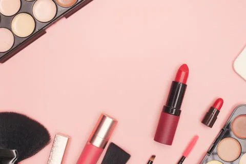 Set of professional cosmetics, makeup tools and accessories on pink background Stock Photos