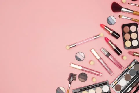 Set of professional cosmetics, makeup tools and accessories on pink background Stock Photos