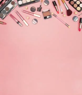 Set of professional cosmetics, makeup tools and accessories on pink background Stock Photos