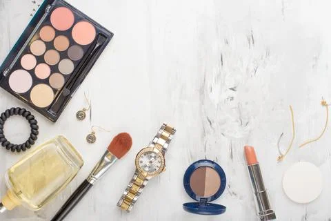 Set of professional cosmetics, makeup tools and accessories on a white marble Stock Photos