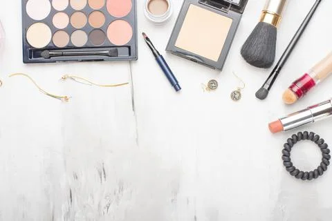 Set of professional cosmetics, makeup tools and accessories on a white marble Stock Photos