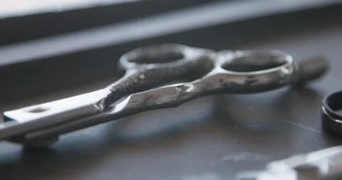Set of professional hairdressing tools close up. Hairdresses scissors and ha Stock Footage 190445823