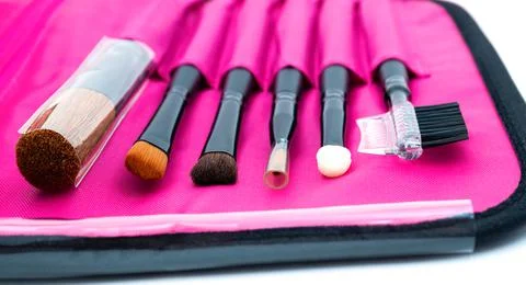 A set of professional tools for face makeup in a pink case. Stock Photos