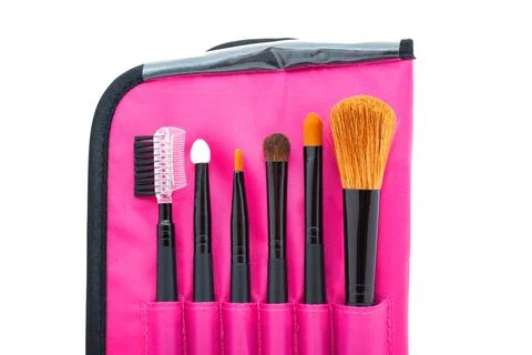 A set of professional tools for face makeup in a bright pink case. Top view Foto stock