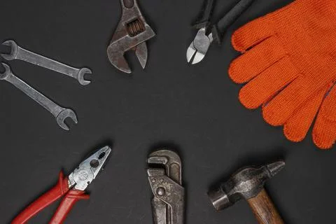 Set of professional work tools on black background. Top view. Copy space 写真素材