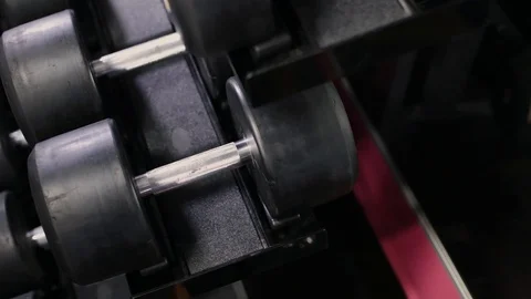 Set, a rack of dumbbells of different sizen for training, close-up. Video stock 102272440