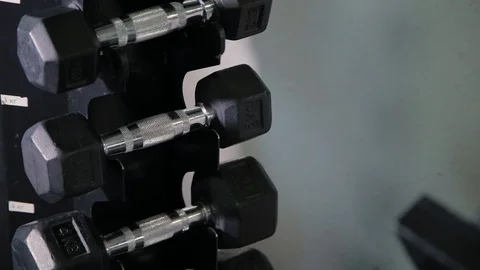 Set, a rack of dumbbells of different sizen for training, close-up. Stock Footage 103394763