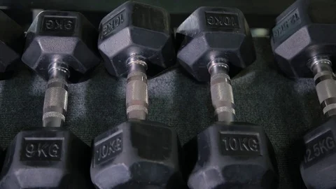 Set, a rack of dumbbells of different sizen for training, close-up. Stock Footage 103394782