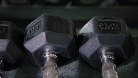 Set, a rack of dumbbells of different sizen for training, close-up. Stock Footage 103394804