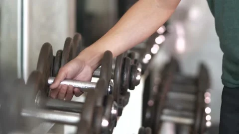 Set, a rack of dumbbells of different sizen for training, close-up. Stock Footage 166931947