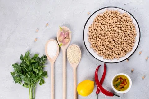 Set of raw ingredients for making hummus. Middle eastern cuisine. Top view Stock Photos