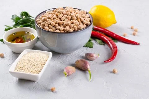 Set of raw ingredients for making hummus. Middle eastern cuisine. Top view Stock Photos