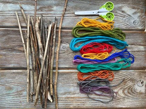 The set is ready for needlework with natural materials, dry sticks and yarn. Stock Photos