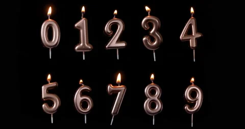 A set of Realistic full-sized birthday candle numbers isolated on black back Stock Footage 142750757