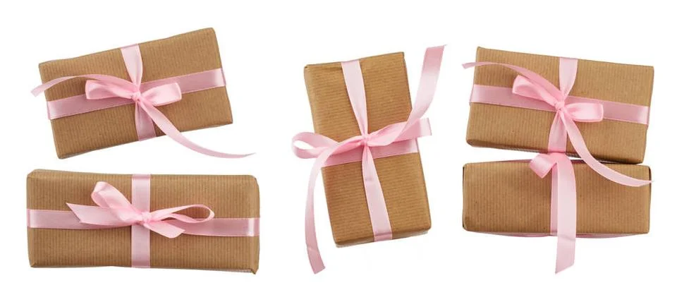 Set of rectangular boxes wrapped in brown kraft paper and tied with a pink... Stock Photos