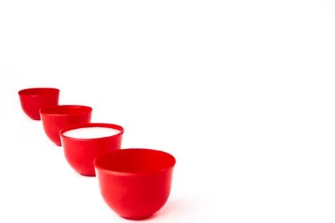 Set of Red cups on table isolated on white background Stock Photos
