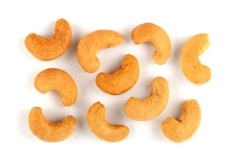 Set of roasted Cashew nuts isolated on white background. Stock Photos