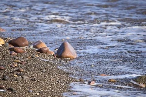 Set of rocks on the shore of the beach Stock Photos
