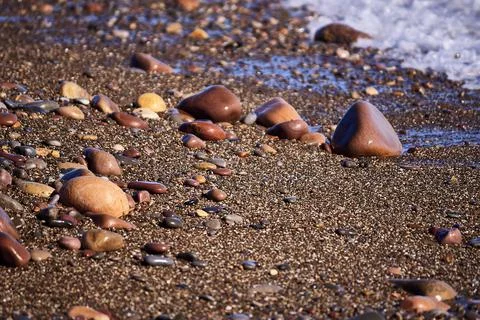 Set of rocks on the shore of the beach Stock Photos