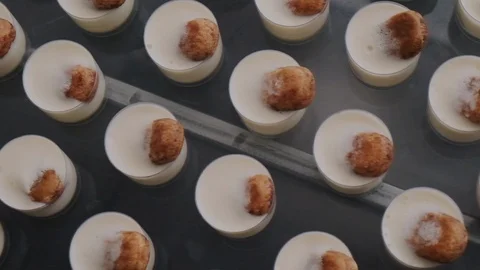 Set of round desserts with almond-looking top Stock Footage 128173874