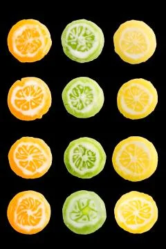 Set of round, small, multi-colored caramel candies in form of citrus slices.  Stock Photos