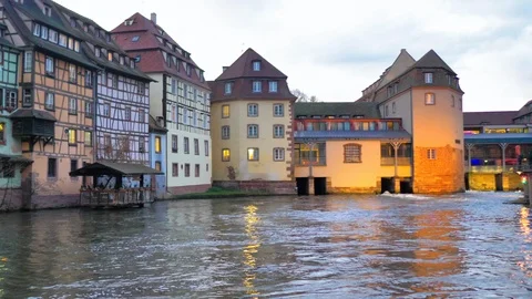 Set of rustic facades next to canal and mill Stock Footage 124477858