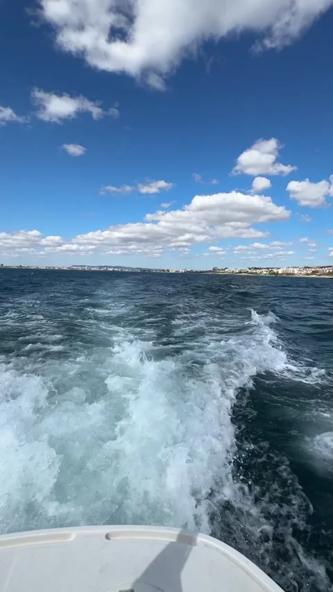 Set sail on a beautiful sunny day with blue skies and floating clouds, wate.. Stock Footage 316923177