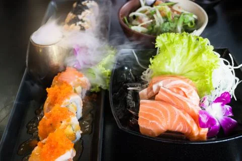 Set Of Salmon Menu Served On Black Plate Stock Photos