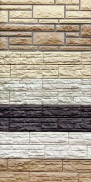 Set of samples of facade panels, siding with a stone texture of different c.. Stock Photos