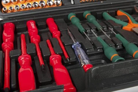 Set of screwdrivers and other tools in black box Stock Photos