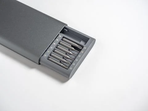 A set of screwdrivers with bits in a case isolated on a white background. Cop Stock Photos