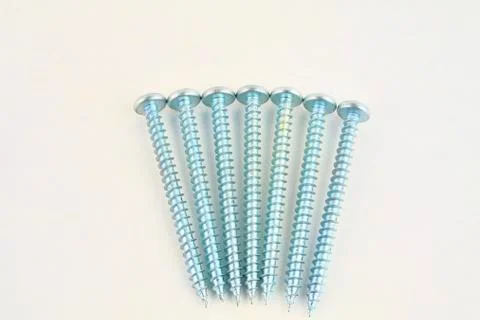 Set of screws for construction on a white background, metal screw, iron screw Fotos de archivo