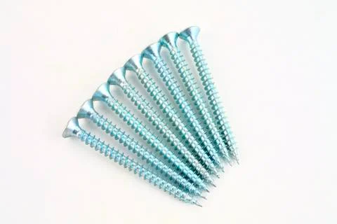 Set of screws for construction on a white background, metal screw, iron screw Фото