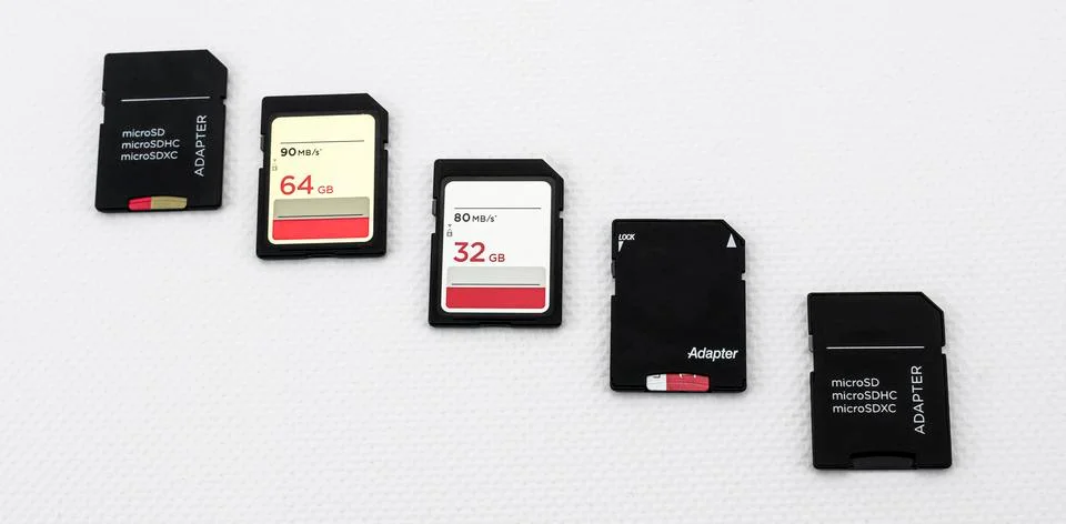 Set of SD and micro SD memory cards, with adapters, on white background Stock Photos