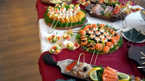 Set of seafood rolls with fish, caviar and shrimps on a buffet table, orbiting Stock Footage 114063769