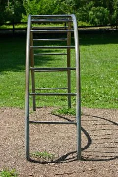 A set of semi circular bars in an empty playground Stock Photos