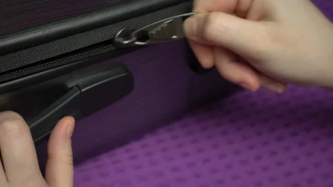 Set of sequential footage. Macro shooting opening of a suitcase zipper, opening Stock Footage 105624788