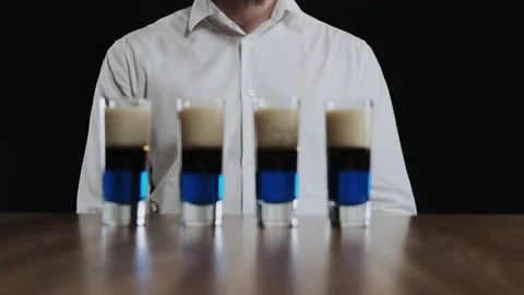 Set of several shot glasses with lexus cocktails. Ready for drinking Stock Footage 132743584