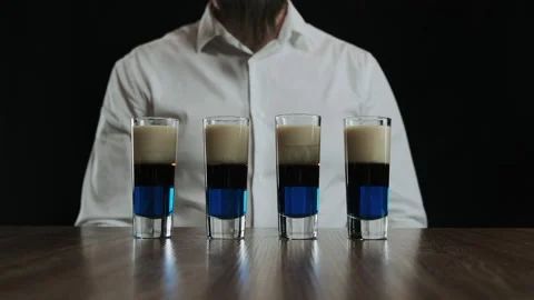 Set of several shot glasses with lexus cocktails. Ready for drinking. Zoom out Stock Footage 133955320