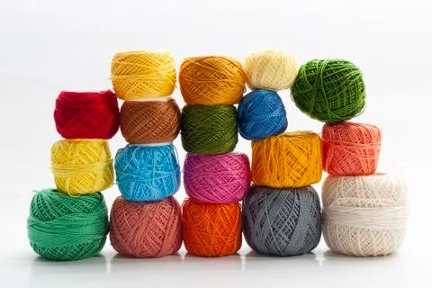 Set of several spools of thread of different colors, a pair of scissors and a Stock Photos