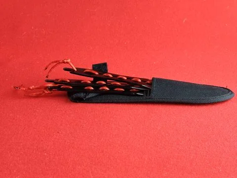 A set of several throwing knives in a case for combat training and sport th.. Stock Photos