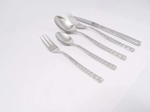Set of silver fork knife spoon on white surface Stock Photos