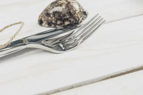 Set of silverware on white wooden table close up Stock Photos