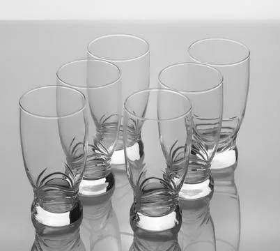 Set of six elegant empty glasses isolated on white background Stock Photos
