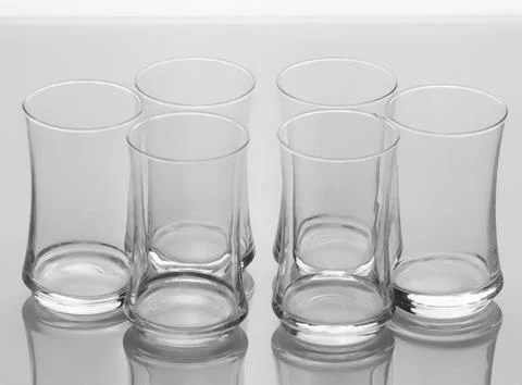 Set of six elegant empty glasses isolated on white background Foto stock